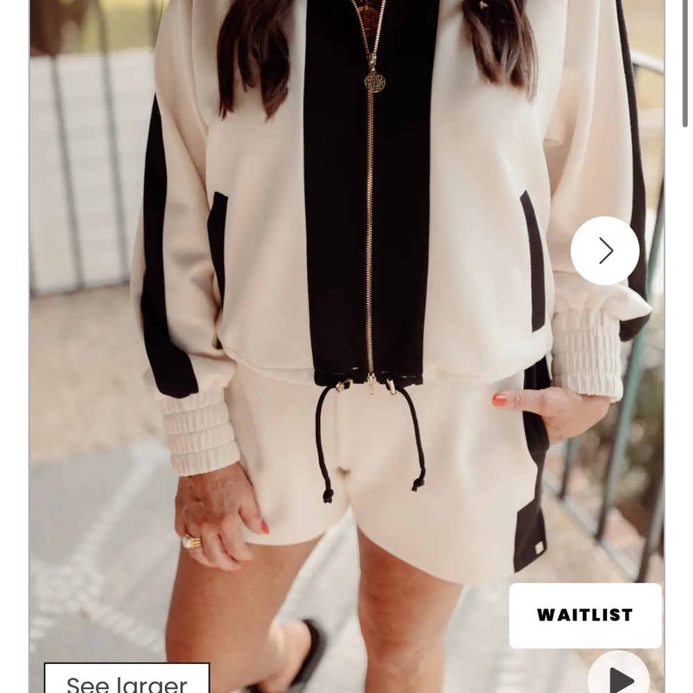 Emily McCarthy black and sand Bailey bomber jacket